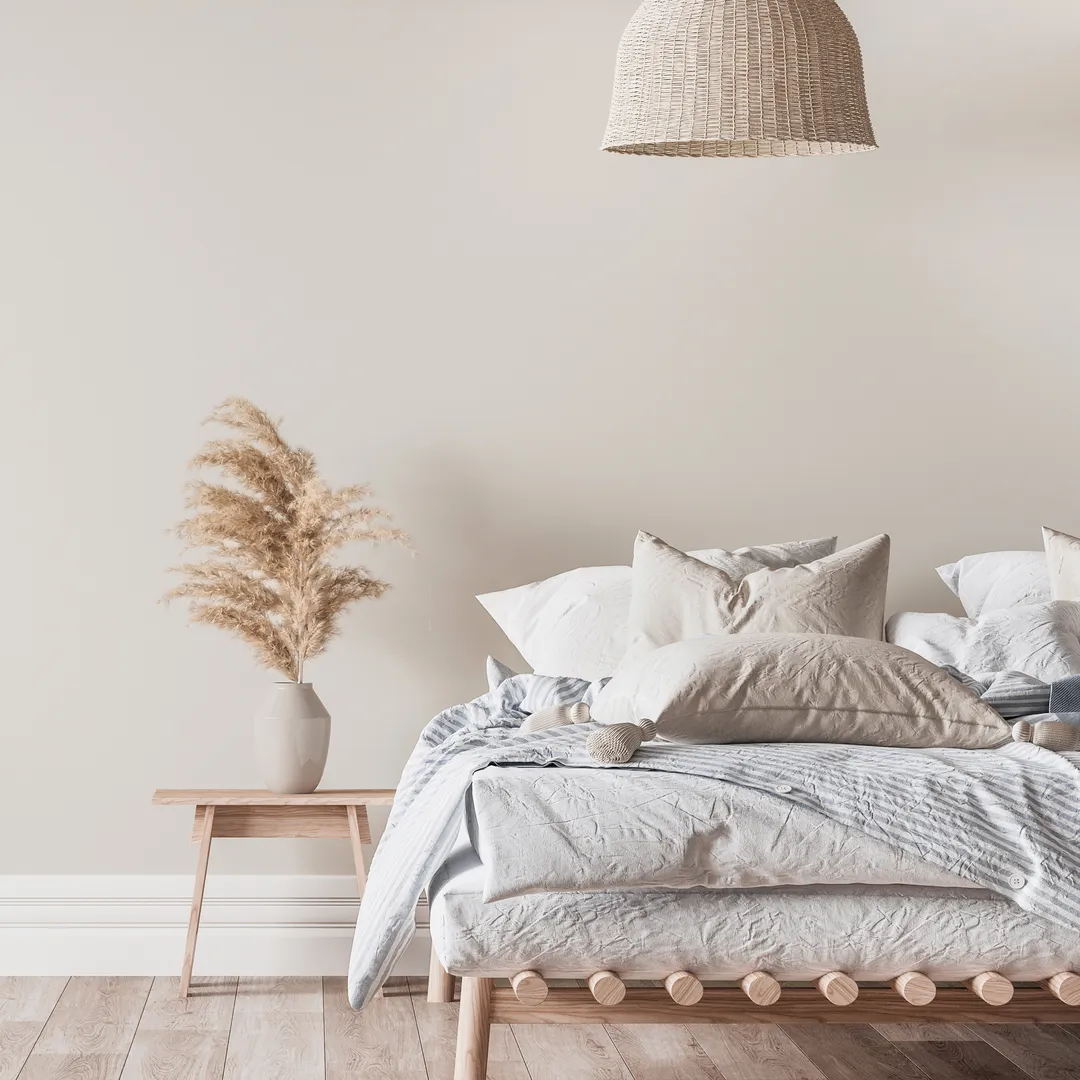 Neutral bedroom with pampas grass and linen bedding